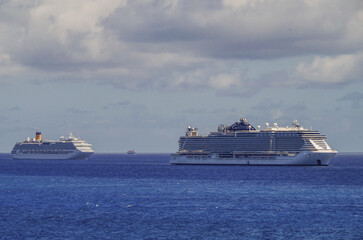 Modern cruiseships cruise ship liners Magica, Seaside, Armonia and Fortuna anchored offshore of...