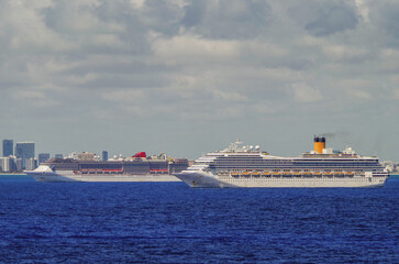 Modern cruiseships cruise ship liners Magica, Seaside, Armonia and Fortuna anchored offshore of...