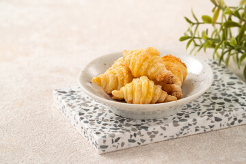 Mini Puff Pastry One Bite Croissants with Sugar on Ceramic Plate