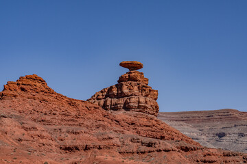 Mexican Hat Rocks  is a Balanced Rock, San Juan County, Utah. a caprock of Cedar Mesa Sandstone and...