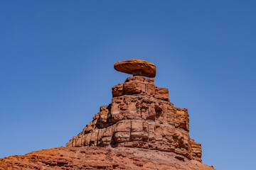 Mexican Hat Rocks  is a Balanced Rock, San Juan County, Utah. a caprock of Cedar Mesa Sandstone and...