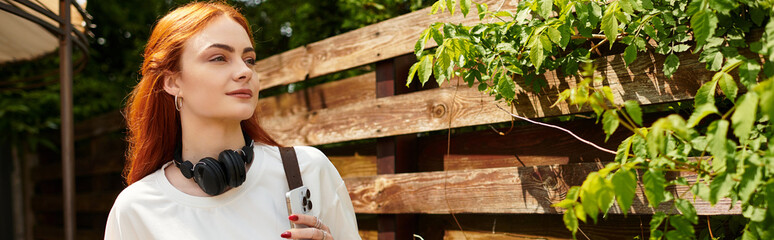 Fototapeta premium Relaxing moments outdoors with music in the fresh air surrounded by nature