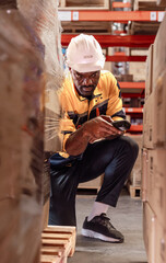 Warehouse manager, store inspector checking stock on storage shelf from inventory checklist. Two...