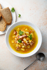 Traditional pea soup with smoked bacon