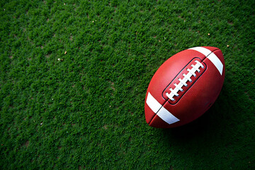 american football on green grass