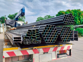 Rectangular hollow steel tubes stacked for industrial use, commonly applied in structural framing, fabrication, and modern construction projects.