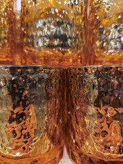Abstract reflection in amber glass surface Christmas