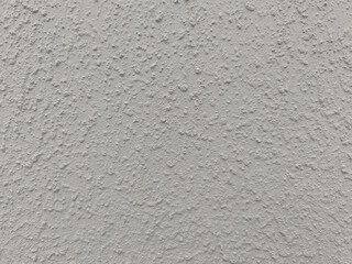 Textured gray concrete wall with rough surface