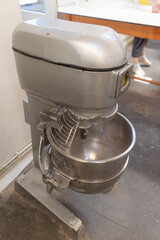 Industrial dough mixer for bread. Manufacturing process of handcraft bread.