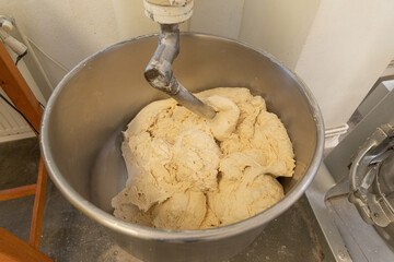 Industrial dough mixer for bread. Manufacturing process of handcraft bread.