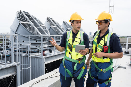 Cooling tower operations, Induced draft cooling towers service.
Team of engineer or technicians maintenance and repair of cooling towers for preventing issues Legionella growth on rooftop of building