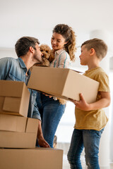 New home. Parents with child moving in new house, property mortgage and real estate investment.