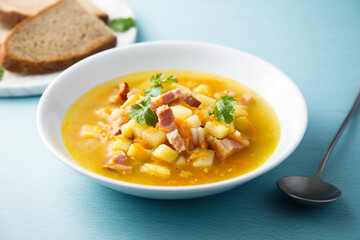 Traditional pea soup with smoked bacon