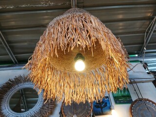 unique lamp shape with straw around the lamp