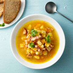 Traditional pea soup with smoked bacon