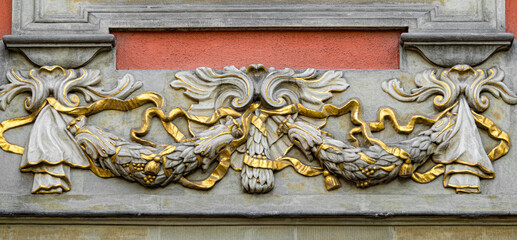 Stone wall with carved floral pattern