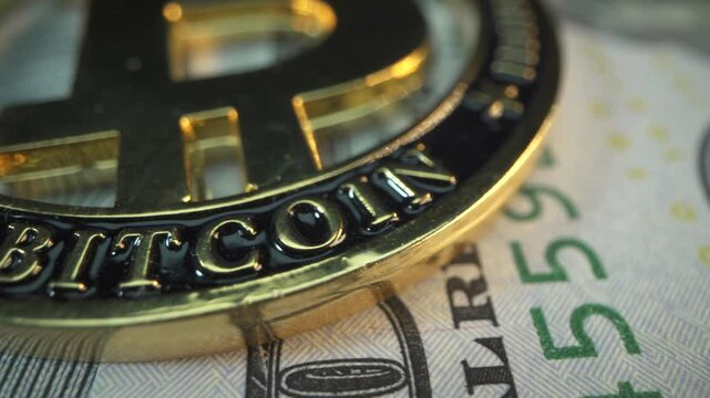 Bitcoin is Spinning on a Table with Golden Sand. Slow Motion