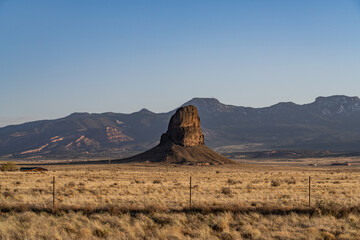 Indian Service Rte 13, The border between New Mexico and Arizona. In the distance is Roof Butte, a peak in the Chuska Mountains in Arizona.
