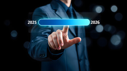 Obraz premium A businessman in a suit interacts with a futuristic digital interface, selecting the years 2025 and 2026, against a dark, blurred background