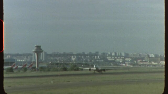 Filmed on super 8 film - airplane taking off from airport runway