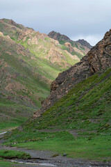 Green mountain valley and stream in Yolyn Am, Gobi Gurvansaikhan National Park, Mongolia