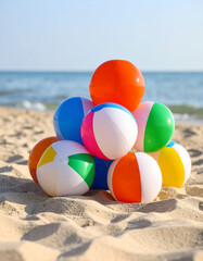 Obraz premium Colorful beach balls resting on the white sand, with the turquoise sea in the background and a clear sky. Cheerful and carefree summer scene, symbol of fun, vacation and outdoor games by the sea.