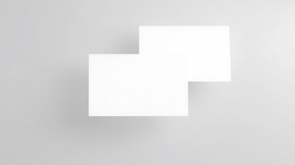 Clean white square cards overlapping on a subtle light gray background with soft shadows for mockup design