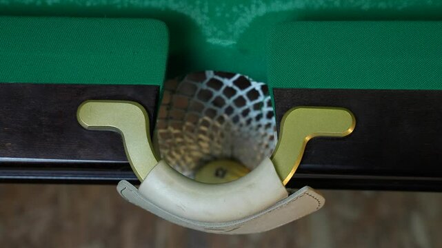 Russian billiards blow cue over the ball, unsuccessfully. Close-up.