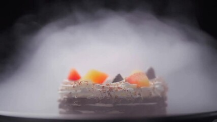 Luxurious cake with vibrant fruit toppings and a misty, ethereal presentation.