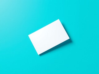 A clean white rectangular card is placed diagonally on a bright turquoise blue background with a subtle shadow