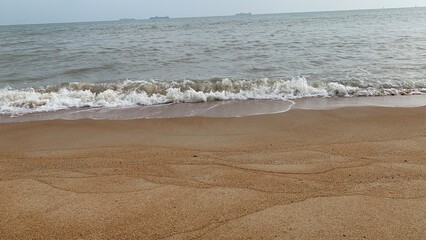 A beach is a narrow, gently sloping strip of land that lies along the edge of an ocean, lake, or river. Beautiful Sea Beach.