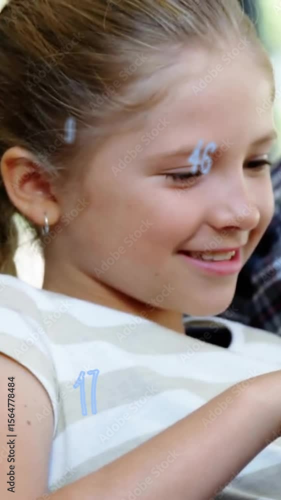 Poster Animation of falling numbers over close up of smiling caucasian girl using digital tablet