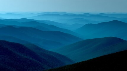 Obraz premium Misty Mountain Ranges in Deep Blue Hues.