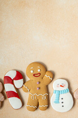 Gingerbread cookies with icing decoration. Christmas food. Gingerbread snow man baking. Top view...