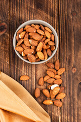 Almond oil with almond nuts.