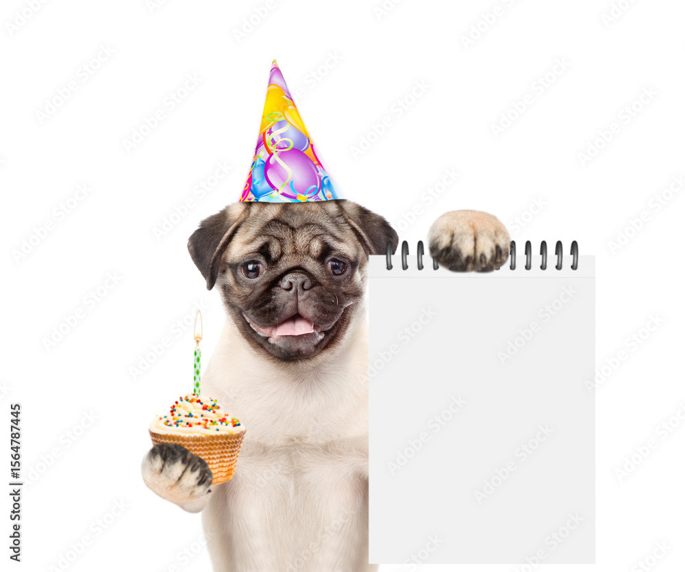 Poster pug puppy wearing a party cap holds birthday cupcake with burning candle and notepad with empty list