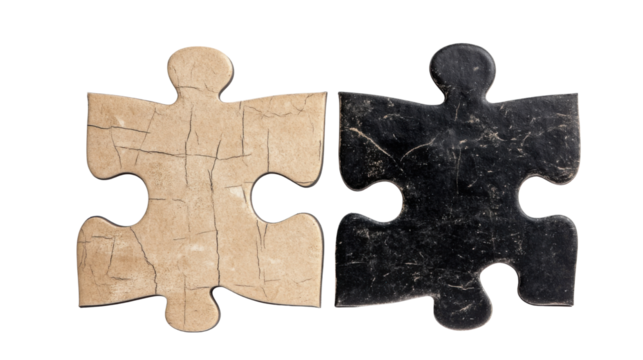 two puzzle pieces one black and one beige on white background