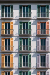 Fototapeta premium Symmetrical Apartment Building Facade with Alternating Colors