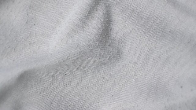 Old cotton gray fabric, pilling on the surface.