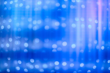 blurred focus of decorative lights in blue background