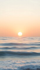 Obraz premium Serene ocean waves reflecting the warm glow of a setting sun