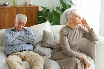 Marriage crisis relationship problems. Old couple quarreling. Sad mature disappointed woman sitting...