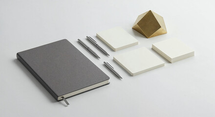 Minimalist Workspace Mockup with Notebook, Pens, and Geometric Object