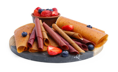 Delicious fruit leather rolls and berries isolated on white