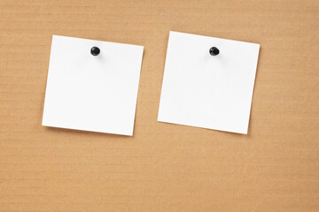 Blank notepaper and space for text with push pins on cardboard background. note blank paper cards. noticeboard on catron board. sticker. blanks for designers