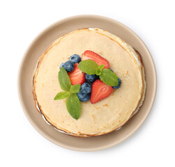 Delicious crepes with berries, cream and mint isolated on white, top view