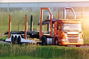 Empty car carrier trailer on rural road
