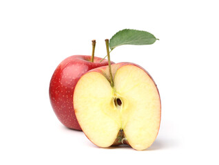 Half and whole red apples with leaf isolated on white