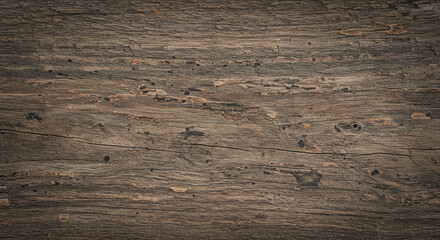 Fototapeta premium Dark brown wood grain texture showing natural knots and patterns.