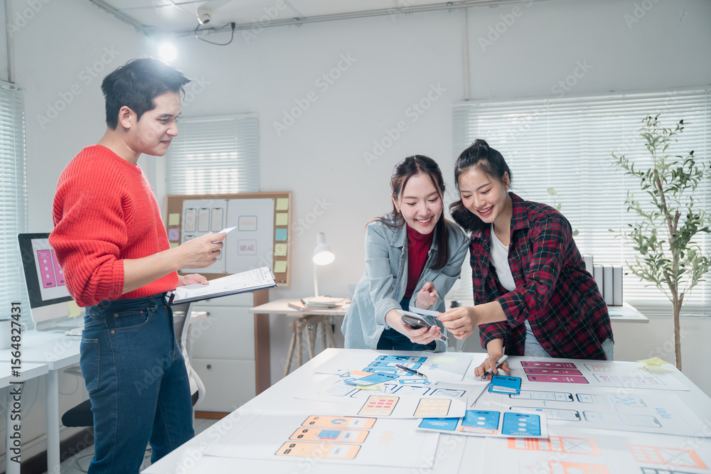Poster young professionals brainstorming ideas for a mobile app design. using digital tools and mockups, th